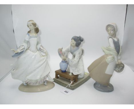 Two Lladro Figures and a Nao Figure