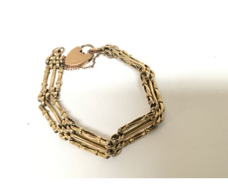 A 9carat gold gate bracelet with padlock clasp weight 14.5g