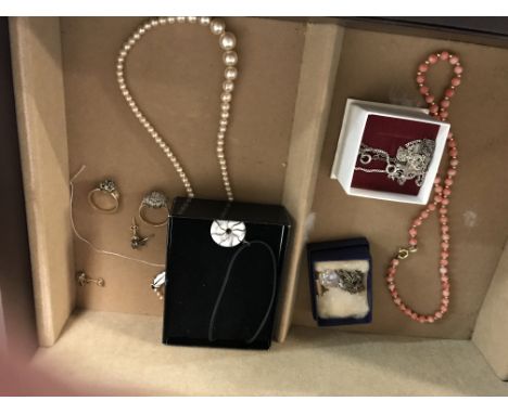 A small collection of costume jewellery silver chains coral necklace fitted in jewellery box .