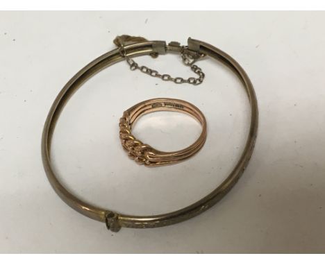 A 9carat gold rose gold keeper ring and an unmarked bangle. Weight 7g.