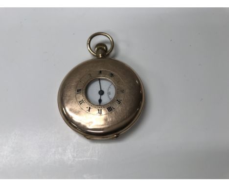 A 9 ct gold pocket half hunter pocket watch button wind with Roman numerals.