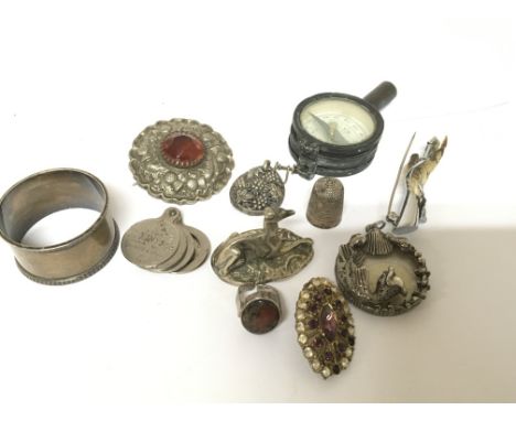 A Scottish brooch a silver napkin ring small compass a silver ring set with Moss-agate and other oddments (a lot)