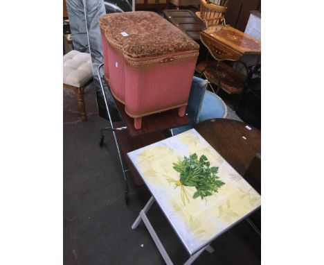 Three items of furniture comprising a Lloyd Loom basket, a folding table and a folding trolley. 