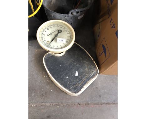 Weighing scales and a galvanised bucket 