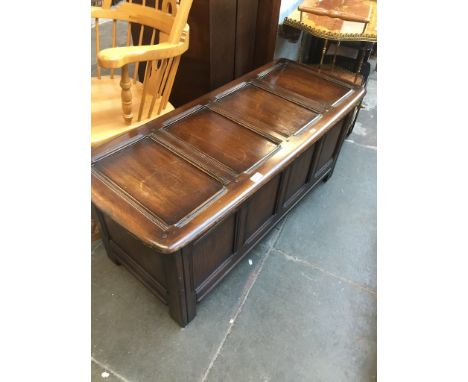 An Ercol dark elm Priory style chest. 