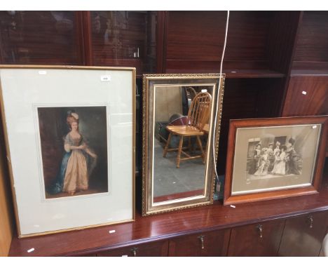 A colour print, a mirror and an old photograph. 