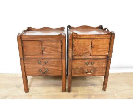 Near pair of George III mahogany bedside cupboards, each with gallery top and twin cupboard doors with pull out commode drawe