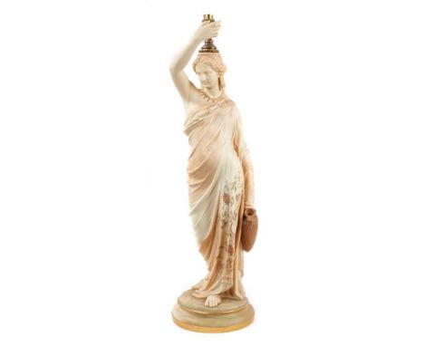 A Royal Worcester blush ivory figural lamp, in the form of a Grecian water carrier, shown gesturing with her right hand, in h