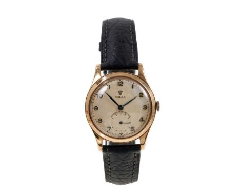 1950s Rolex gold wristwatch, the circular cream dial with applied gold Arabic numerals, subsidiary seconds dial and blued ste