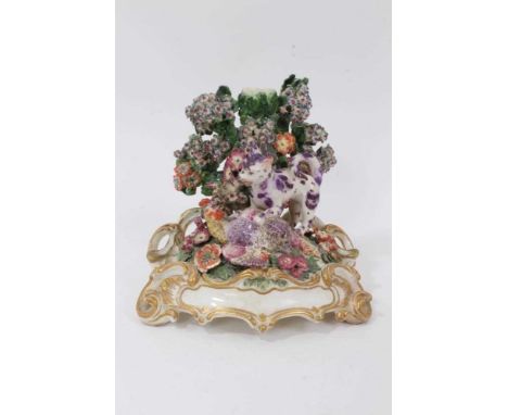 A Chelsea ‘Fable’ candlestick group, circa 1760, polychrome decorated on a scrollwork base, 14cm highThe group has been quite