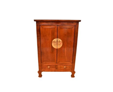 Antique Chinese cherrywood cupboard, enclosed by a pair of panelled doors with ornate lock plate, pair of drawers below on br