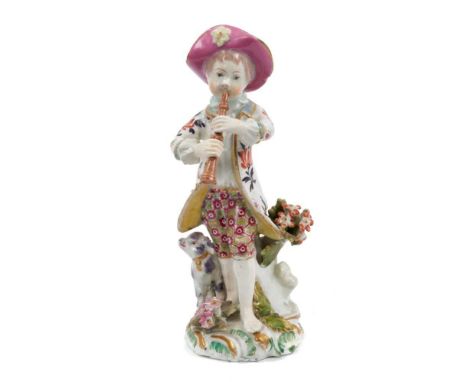 A Bow figure of a piping shepherd boy, circa 1765, modelled standing barefoot with a dog by his side, on a floral encrusted s