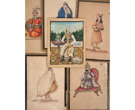 19th century Indo-Persian miniature portrait on paper, depicting a nobleman, seated at a table on a veranda, a dog at his sid