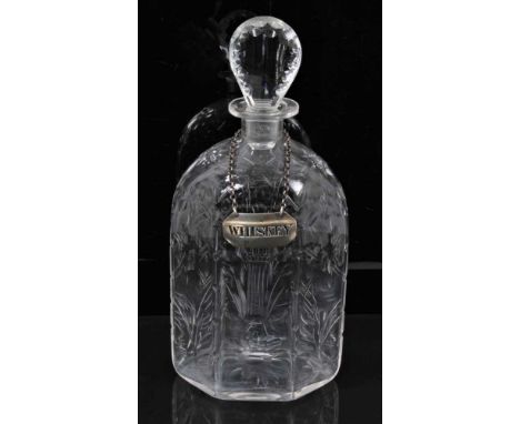 An 18th century Dutch glass decanter with cut floral decoration and lozenge stopper, together with Whiskey label, 25cm high(C