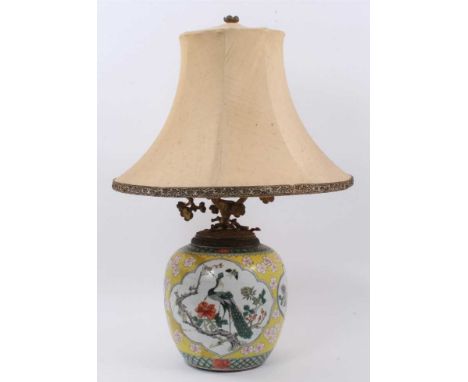 Chinese famille jaune porcelain jar, decorated with panels containing flowers, insects and a peacock, on a yellow ground with