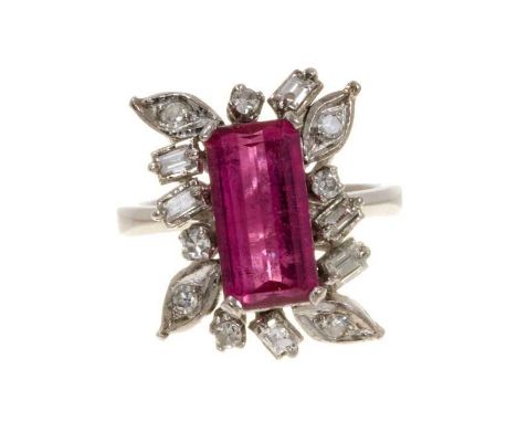 Pink tourmaline and diamond cluster cocktail ring with a rectangular step cut pink tourmaline measuring approximately 12.3mm 