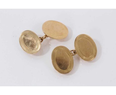 Pair of 18ct gold cufflinks with oval panels with engine turned border.15.4 grams