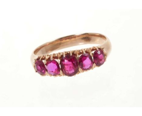 Victorian ruby five-stone ring with five graduated oval mixed cut rubies in gold claw setting on gold shank, ring size O.The 