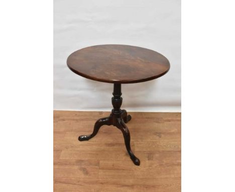 Mid 18th century mahogany tripod table, with well figured solid circular tilt top on vase shaped column and tripod cabriole l