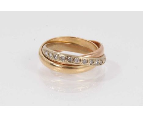 18ct three-colour gold ‘Russian wedding ring’, set with a band of diamonds, marked 750. Finger size approximately P.Weighs ap