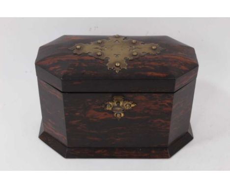 A Victorian coromandel and brass mounted two-division tea caddy, of canted form, on spread plinth base, 24cm wide 