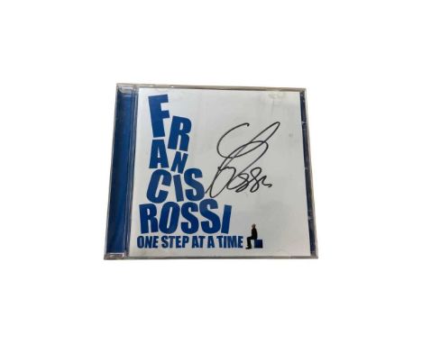 A copy of Status Quo's Francis Rossi: One Step at a Time CD, signed by Rossi in black ink.