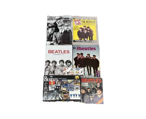 A mixed lot of Beatles memorabilia, to include poster books, calendar, jigsaw puzzle, Royal Mail First Day Cover Stamps etc