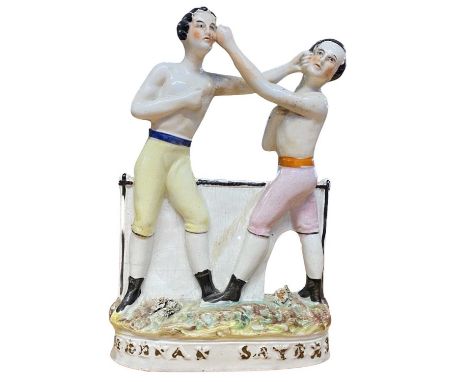 A Staffordshire figure of Heenan and Sayers, boxing group, mid/late 19th Century.The boxing match was the first international