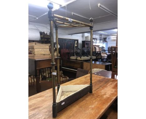 A brass and cast iron stick stand