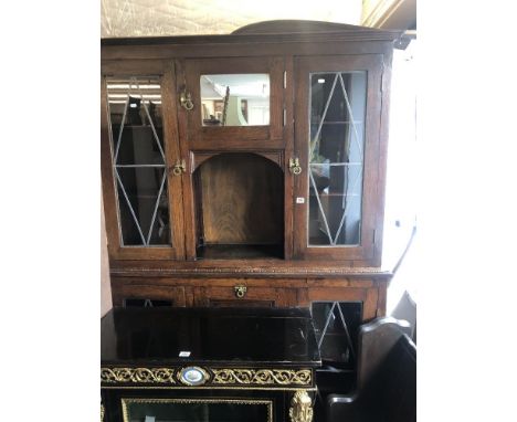 An oak leaded light cabinet