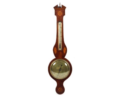 A 19th Thomas Bates, Market Harborough wheel shaped wall barometer. The mahogany case with open swan neck pediment silver dia