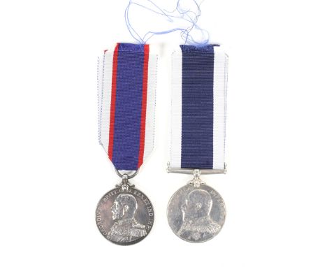 An Edward VII Royal Navy long service and Good Conduct medal and a George VI Volunteers medal. The first awarded to A J Hedge