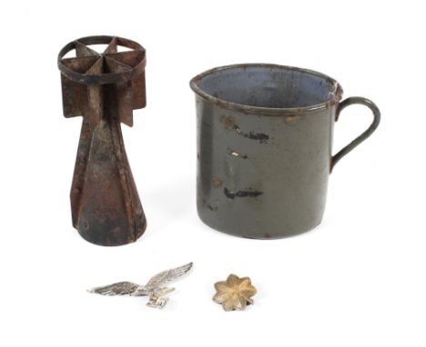 An assortment of military related collectables. To include a Third Reich cap badge, WWII era mortar shell case, gilt metal ba