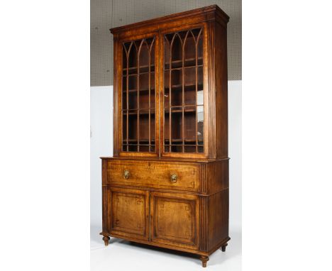 A fine mahogany Regency secretaire bookcase with reeded columns. The top section having a moulded cornice above a pair of ast