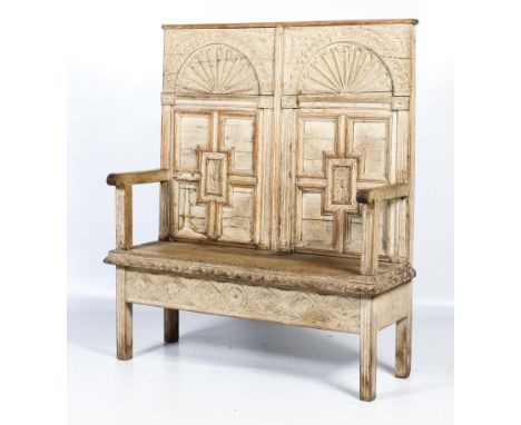 A well constructed, converted, limed high back settle. Possibly constructed from an 18th century coffer with later arms, with