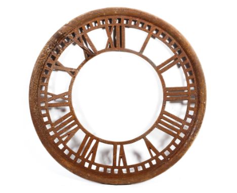A large vintage cast iron clock face. With Roman numerals to chapter ring, 97cm diam. 
