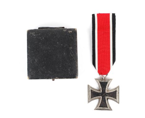 A German WWII Third Reich 1939 Iron Cross medal. The silvered frame surrounding a magnetic iron core, sealed suspension ring 