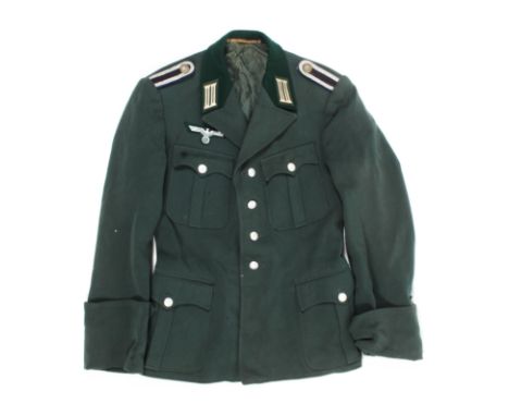 A German Third Reich WWII army officers jacket. With four buttons to the front and related shoulder and chest badges, label t