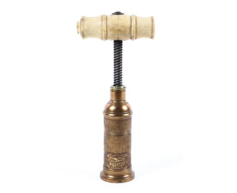A 19th century bone handled J F Lee patent corkscrew. The engine turned gilt metal handle with berried JF Lee Patent badge, 1