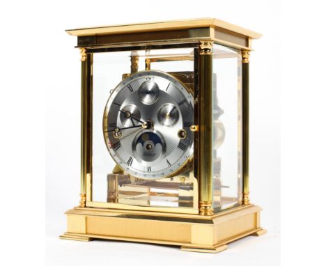 A Kieninger 8-day moonphase gilt-metal triple chime mantel clock. With three subsidiary dials to silvered face with black Rom