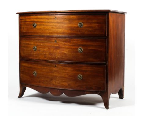 A 19th century bow fronted chest of drawers. of three long graduating drawers with brass ring handles raised on short splayed