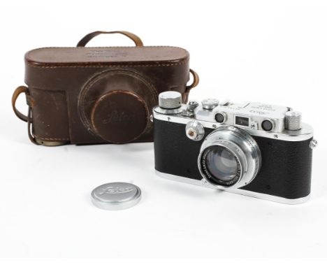 A Leica DRP 35mm range finder camera with lens and original leather case. Numbered 135729, marked Ernst Leitz, Wetzlar D.R.P.