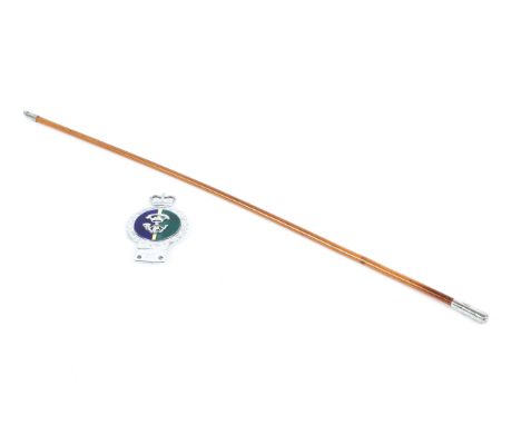 A 20th century military swagger stick and matching car badge. Both adorned with Somerset light infantry regiment emblems, the