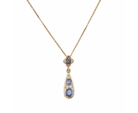A 9ct gold sapphire and diamond drop pendant with chain, with an oval cut sapphire, claw set to an open quatrefoil mount and 