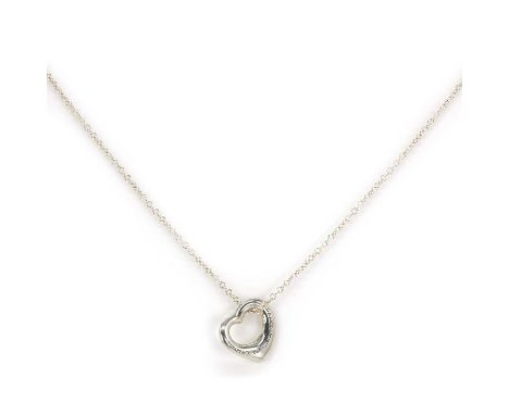 A Tiffany & Co. Elsa Peretti silver heart pendant, on a fine round link chain, the stylised open heart pendant marked 'Tiffan