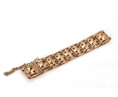 A gold pierced plaque bracelet, designed as a uniform line of rectangular abstract pierced plaques joined top and bottom by s