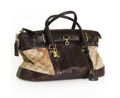 A Gucci canvas and leather handbag, dual rolled handles, gold tone hardware, zip top closure, with interior zip and slip pock