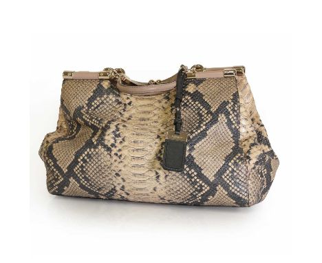 A Coach python embossed leather handbag, gold tone hardware, dual flat handles, twist top closure, interior with zip and slip