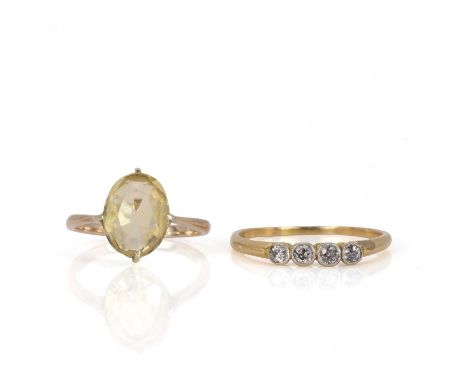 A four stone diamond ring and a citrine ring, the four stone ring set with old cut and round brilliant diamonds in millegrain