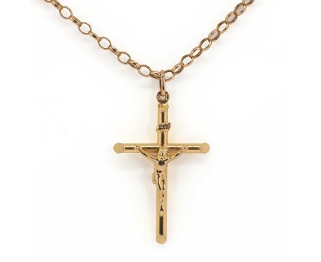 A 9ct gold crucifix pendant,   with a hollow crucifix, length 5cm, width 3cm, on a belcher link chain, length 60cm, both 9ct 